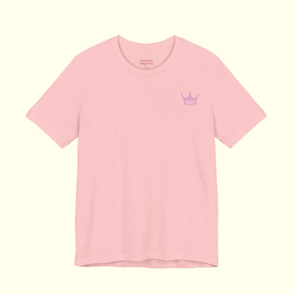 Pink t-shirt with a small logo on a white background