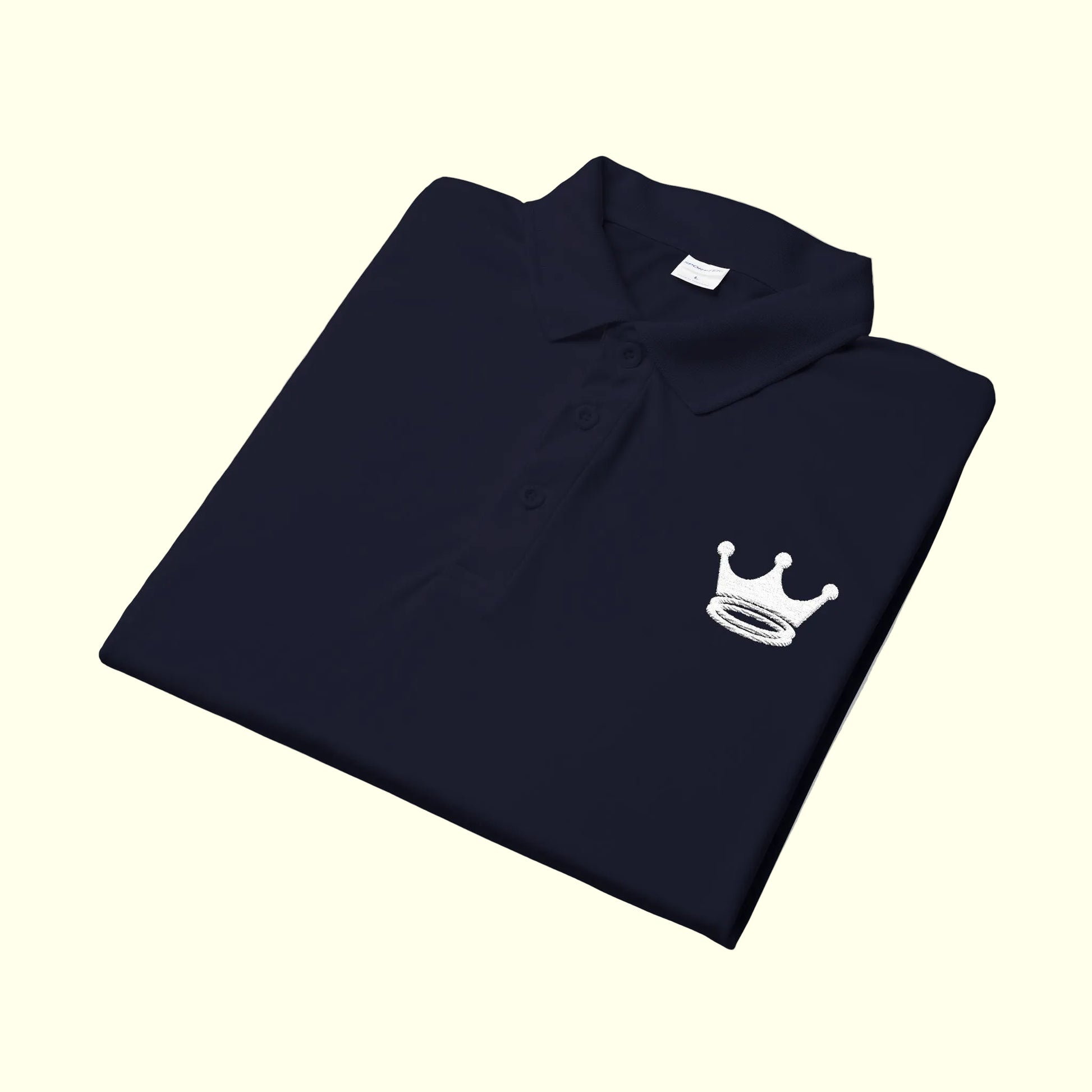 Folded polo shirt with a white logo on a white background